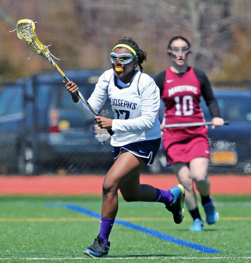 Aneisha Scott, a former Riverhead lacrosse player, played on the conference championship winning St. Joseph's College lacrosse team this spring. (Credit: Daniel De Mato)