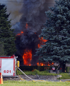 RIVERHEAD, NY - August 7, 2015: At approximately 3:20pm, Riverhead Police and Fire Department were called to 470 Church Lane for a fully involved house fire. Everyone made it out of the house without injury. (Photo by Victor Alcorn) PHOTO CREDIT GOES TO VICTORALCORN.COM