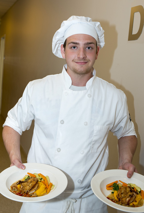 His dish of pan-roasted chicken with a mushroom cream sauce, sautéed vegetables and zucchini, and a sweet potato puree.