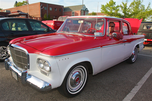 Bruce Grattan of Hampton Bays sits in his 1962 2-door Studebaker Lark. (Credit: Barbaraellen Koch)