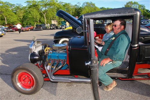 Bruce and Susan Young of Riverhead eating dinner in her 1930 ModelA Ford Pickup which Bruce restored for her as a Christmas-Birthday-Anniversary present three years ago. (Credit: Barbaraellen Koch)