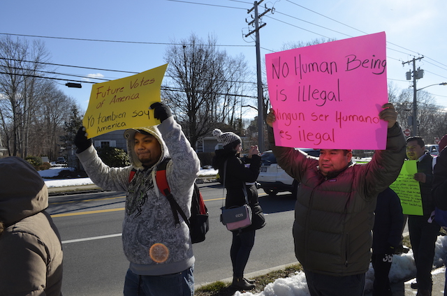 Marchers along Main Street in Hampton Bays.