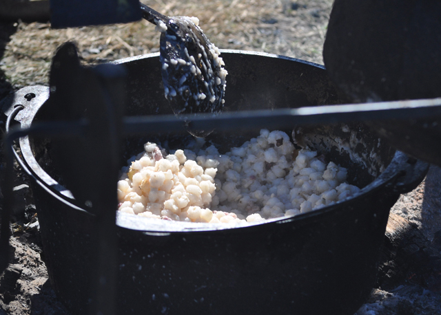 Cooking up a meal on the outskirts of camp. (Credit: Grant Parpan)
