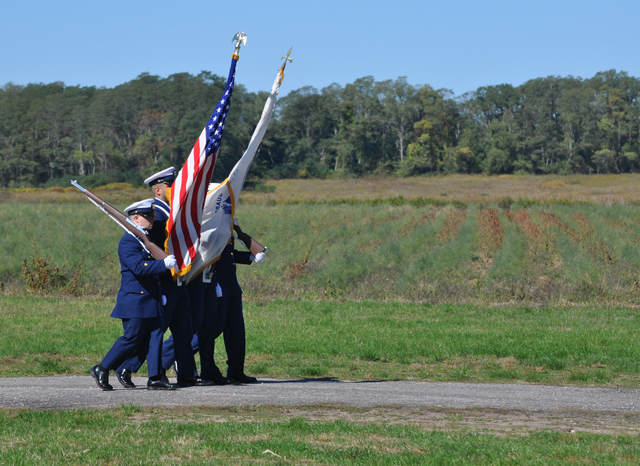 Members of the United States Coast Guard present the colors Sunday. (Credit: Grant Parpan)