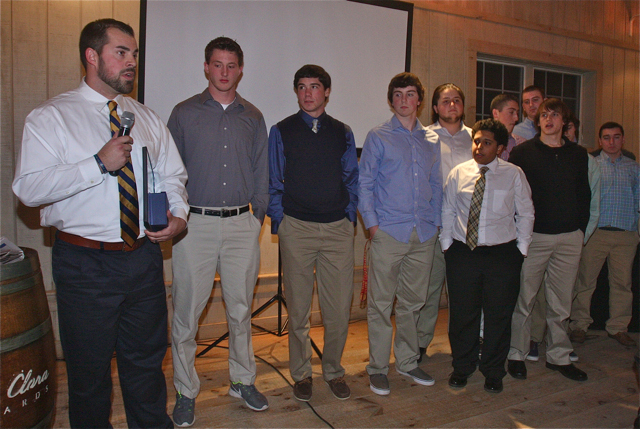 Shoreham-Wading River football coach Matt Millheiser accepts the 2014 News-Review People of the Year award on behalf of the team. (Credit: Barbaraellen Koch)