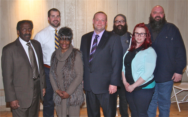 The Riverhead News-Review's people of the year for 2014 pose for a photo at Martha Clara Vineyard Thursday night. Representing the winners were (from left): Carl James, Matt Millheiser, Thelma Booker, Greg Wallace, Matt and Lauri Spitz and Dan Burke. (Credit: Barbaraellen Koch)