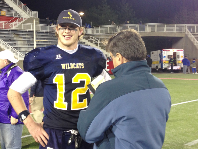 Newsday sportswriter Bob Herzog interviews Shoreham-Wading River quarterback Danny Hughes after the Wildcats won the Long Island Championship in November. (Credit: Joe Werkmeister)