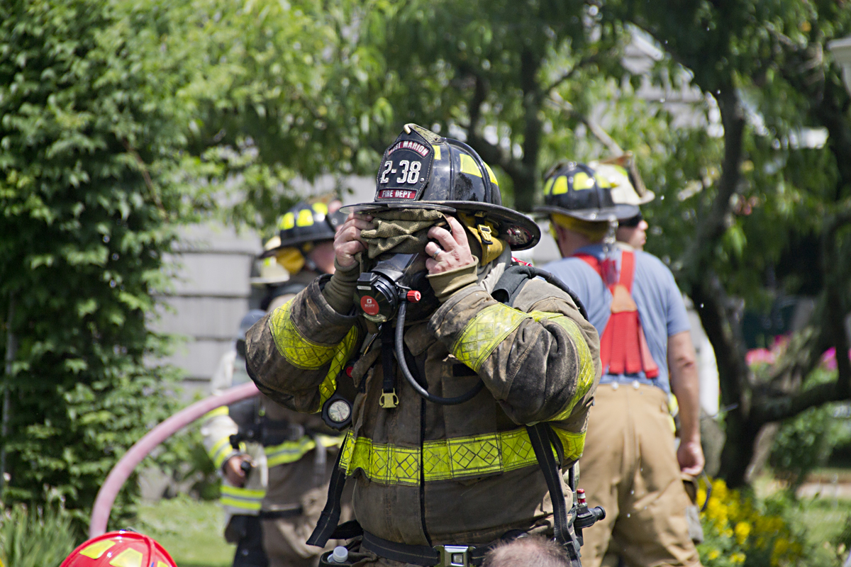 An East Marion volunteer prepares to enter the smoke-filled home on Gillette Drive Thursday morning. (Credit: Paul Squire)