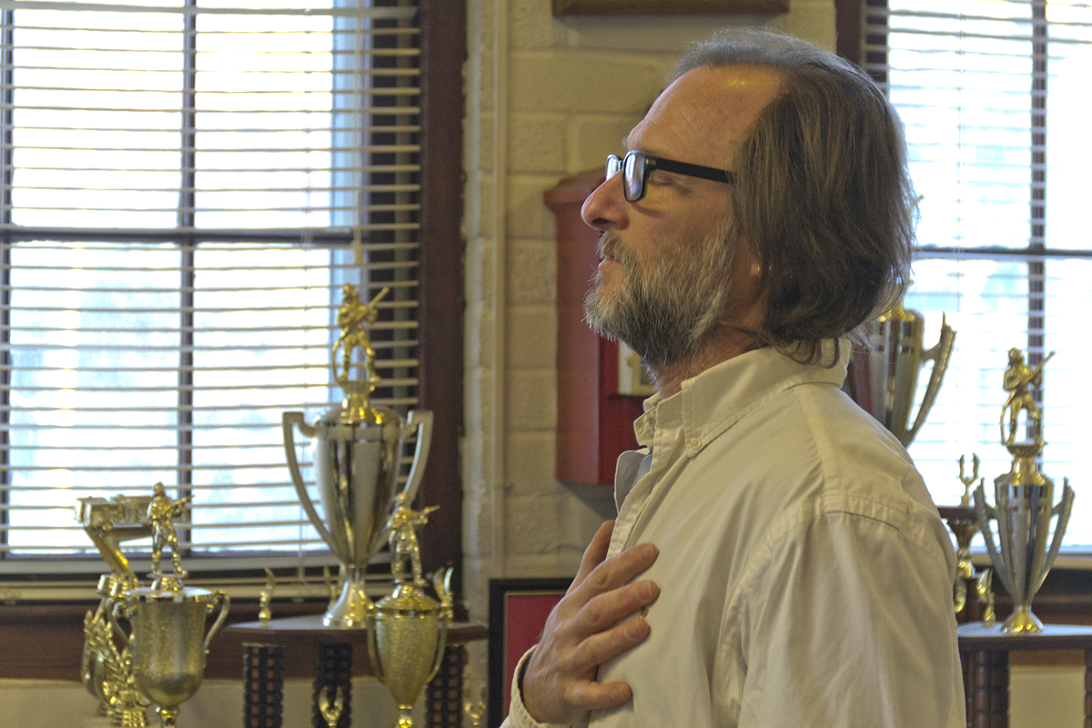 Outgoing Greenport Village Mayor David Nyce recites the pledge of allegiance at Monday's Village Board meeting. It would be his last as mayor. (Credit: Paul Squire)