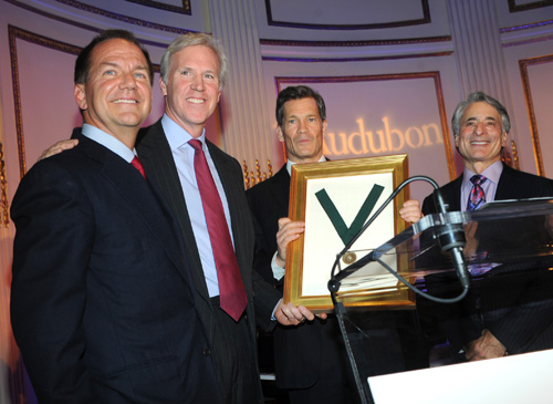 DIANE BONDAREFF/INVISION FOR THE NATIONAL AUDUBON SOCIETY/AP IMAGES PHOTO | Louis Bacon, center, is presented the Audubon Medal and is joined on stage with Paul Tudor Jones, left, Holt Thrasher, second left, Chairman, The National Audubon Society and David Yarnold, right, President & CEO, The National Audubon Society, at the organization's first gala.