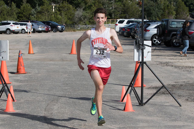 Sam Greenberg crosses the finish line.