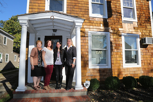 From left: Linda Ruland, Colleen Cummings, Elizabeth Petersen and Sarah Benjamin stand outside of their new building on Friday morning. (Photo: Krysten Massa)