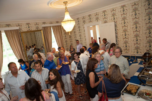 Guests mingle with ship captains and crew.