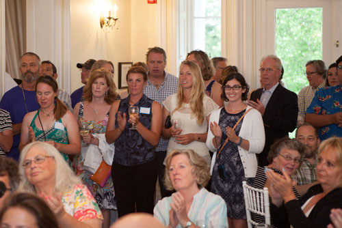 Guests applaud the captains.