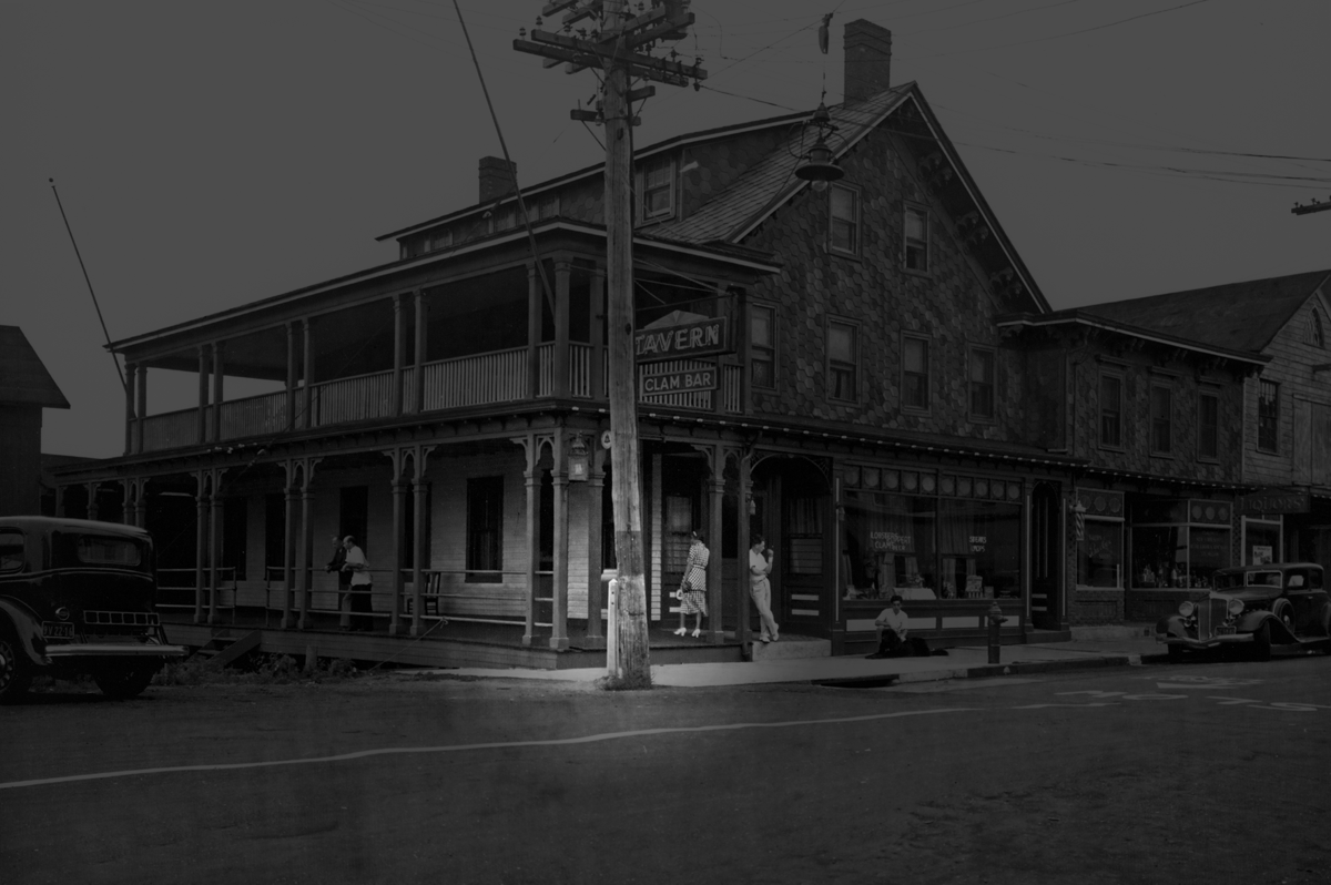 The bright portion of this photo of the outside of what is now Claudio's in Greenport shows the antique mailbox the Post Office plans to remove. Southold Historical Society director Geoffrey Fleming estimated the photo was taken sometime around 1915. (Credit: Claudio family archives) 