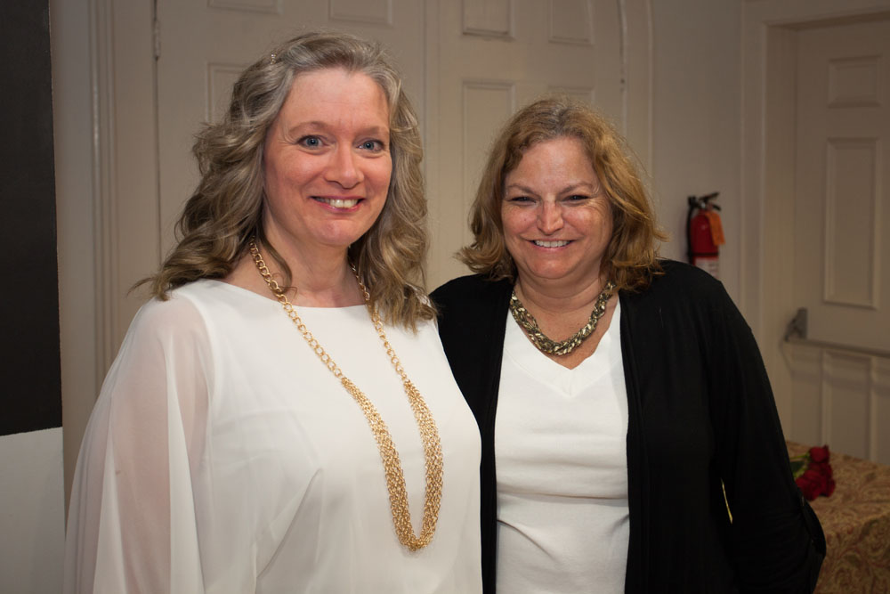 Sharon Carita, Supervisor of Technical Services, left, and Diane Pautke, Circulation staff member. (Credit: Katharine Schroeder)
