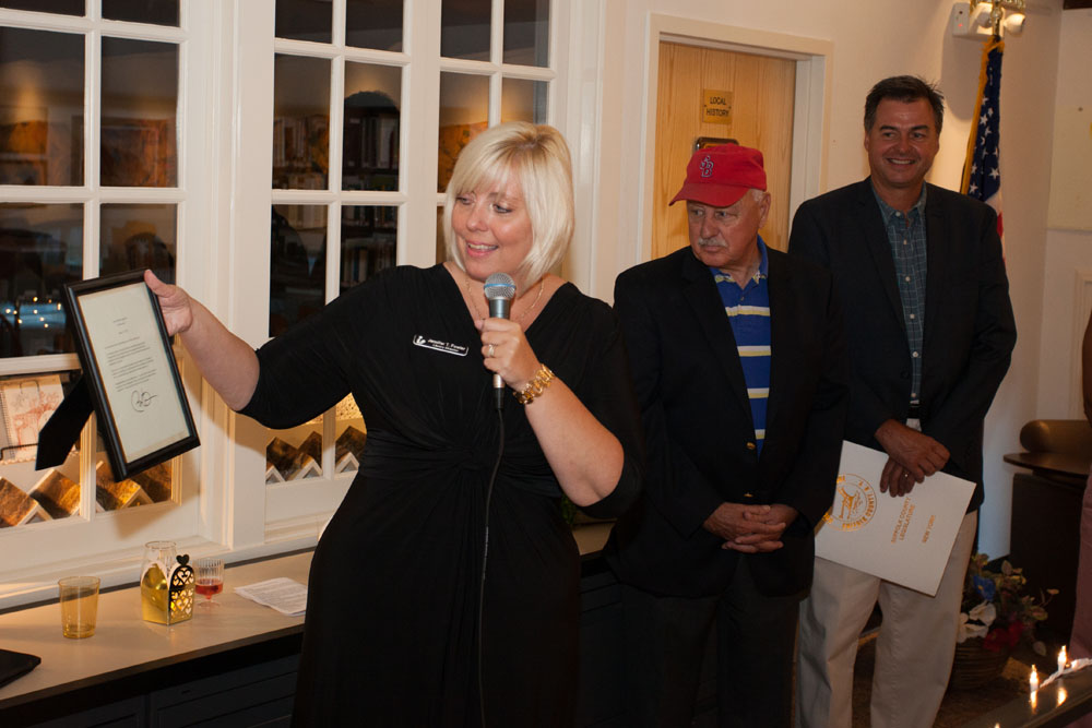 Library director Jennifer Fowler shows off a letter from President Obama which arrived by special delivery. (Credit: Katharine Schroeder)