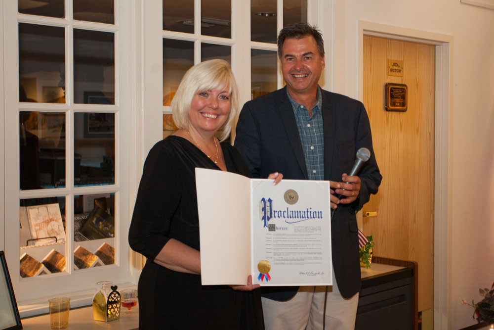 Al Krupski presents Jennifer Fowler with a proclamation. (Credit: Katharine Schroeder)