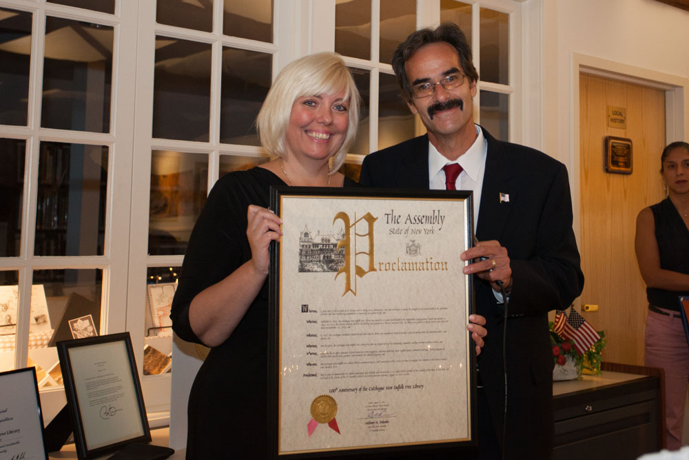 Dennis Noncarrow presents a proclamation on behalf of Assemblyman Anthony Palumbo, who could not attend. (Credit: Katharine Schroeder)