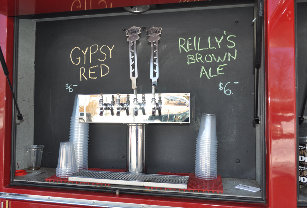 The Crooked Ladder beer truck can serve up to four microbrews at a time. The company plans to soon add a television and grill to the custom-fitted fire truck.