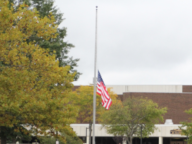 A flag flies at half-mast at Shoreham-Wading River High School last week following the death of junior Tom Cutinella. (Credit: Jen Nuzzo)