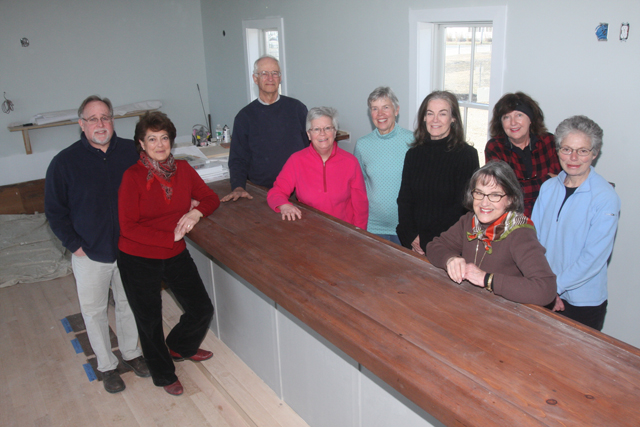 Ken and Maryann Birmingham, left, with New Suffolk Waterfront Fund members inside Case's Place. The organization will continue to use the building for its regular activities. (Credit: Barbaraellen Koch)