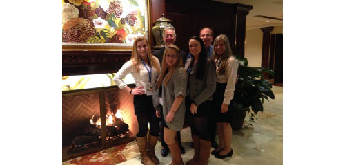 COURTESY PHOTO | Girl Scouts L to R front row: Victoria Hilton, Amanda Aurichio and Paige Confort (all students at Greenport High School) with Troop Leader Ruthanne Corazzini. L to R back row: LITPS Chair Robert Goldfarb, CPA and LITPS Head of Operations: Ross Kass, CPA
