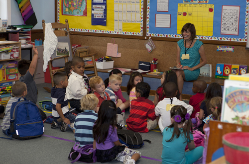 KATHARINE SCHROEDER PHOTO | Miss Gammon at Greenport Elementary School welcomes her class to kindergarten Wednesday morning.