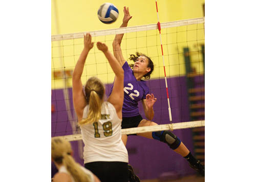 GARRET MEADE PHOTO | Greenport/Southold's high-flying outside hitter, Marina DeLuca, tries to direct the ball past Bishop McGann-Mercy's Emily St. Louis.