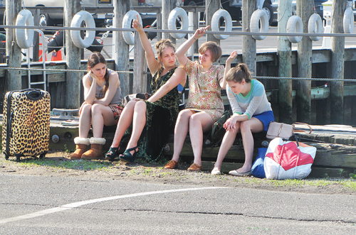 CYNDI MURRAY FILE PHOTO | The four stars of the HBO series ‘Girls’ — Zosia Mamet (from left), Jemima Kirke, Lena Dunham and Allison Williams — film a scene on the Greenport harborfront in June.