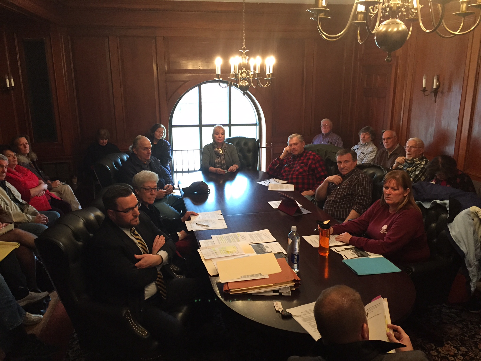 Members of the public ringed the Code Committee table at Wednesday night's meeting. The committee will move forward with a code change to address short-term rentals in the village.