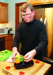 KATHARINE SCHROEDER PHOTO | Putting the garnishes on the Long Island duck.
