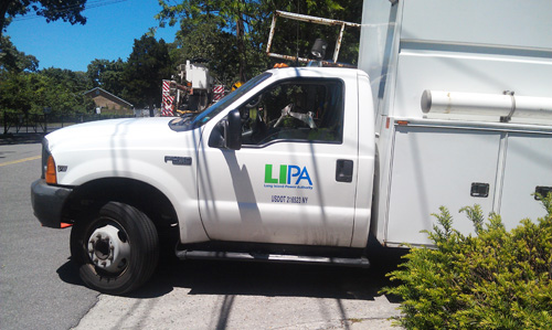 JENNIFER GUSTAVSON PHOTO | Long Island Power Authority trucks on Factory Avenue in Mattituck Wednesday afternoon.