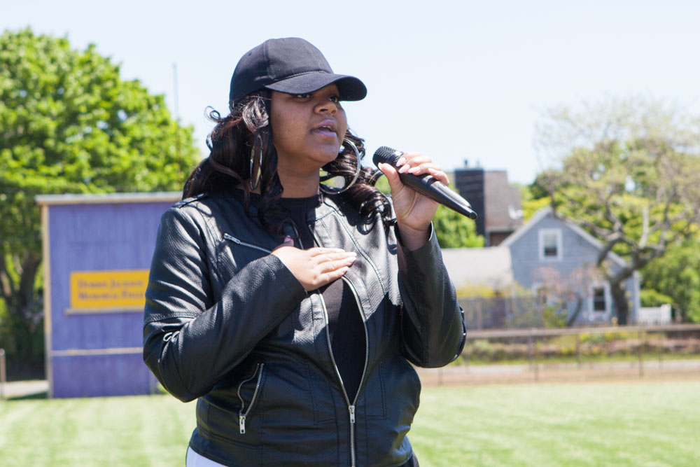Dominique Avilles sings the Star Spangled Banner. (Credit: Katharine Schroeder)