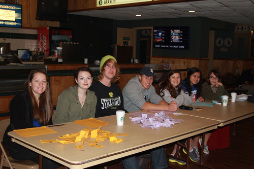 JENNIFER GUSTAVSON PHOTO | Mattituck seniors taking students' tickets at Mattituck Cinemas. On Monday morning, the school showed 