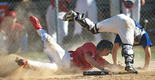 GARRET MEADE PHOTO | Sean Finnegan of Center Moriches upended Mattituck catcher Brian Pelan, but was thrown out at home plate by first baseman Ian Nish on a fielder's choice in the fifth inning.