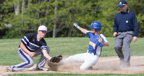 Mattituck's Joe Tardif sliding into third base during Game 1 of the Tuckers' semifinal series against Port Jefferson. (Credit: Katharine Schroeder)