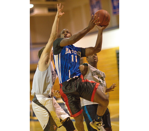 GARRET MEADE PHOTO | Mattituck's Gene Allen attacking the basket during the Brookhaven Summer League small schools final against Westhampton Beach.