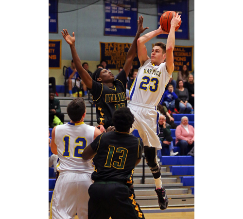 Ryan Mowdy #23 sinks a jump shot over Tyler Damas #12 of Wyandanch. Mattituck lost to Wyandanch 84-71 at Mattituck High School on Jan. 29, 2016.