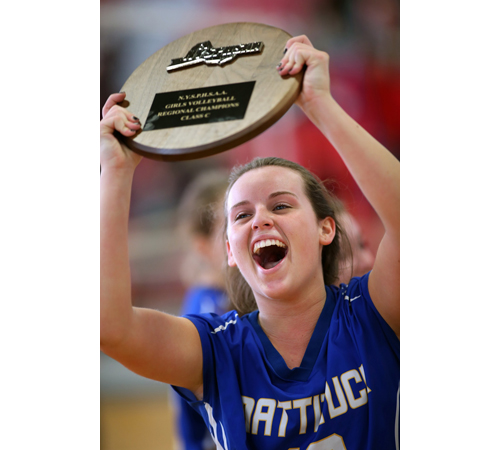 Senior libero Carly Doorhy raises the Long Island Class C championship plaque, Mattituck's fifth in six years. (Credit: Garret Meade)