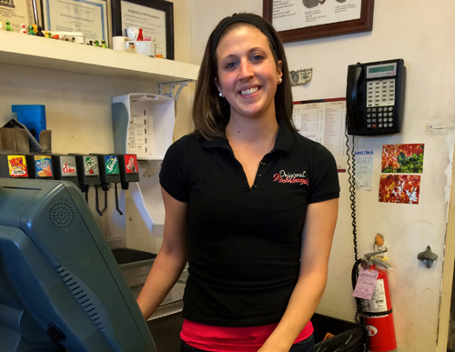 RACHEL YOUNG PHOTO | Server Rebekah Desimone behind the counter at Michelangelo’s Pizzeria in Mattituck Feb. 4. 