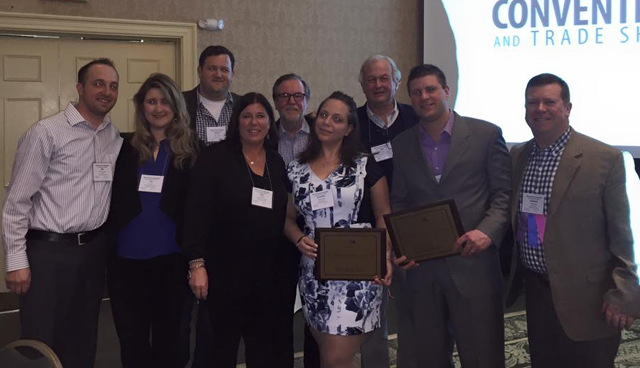 Members of the Times Review staff after accepting the Newspaper of the Year award. (From left to right) Web editor Joe Werkmeister, account executive Liz Person, executive editor Grant Parpan, account executive Tina Volinski, Shelter Island Reporter editor Ambrose Clancy, associate editor Jen Nuzzo, account executive Bill Peters, Suffolk Times and News-Review editor Michael White and publisher Andrew Olsen. (Credit: Terry McShane)
