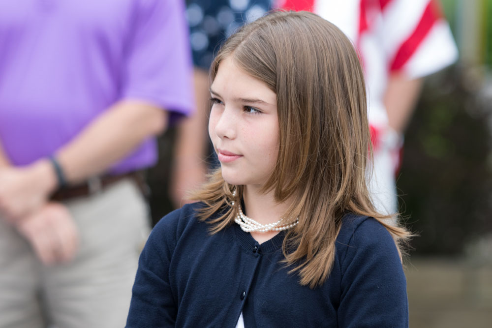 Anabell O'Dell leads the crowd in the Pledge of Allegiance. (Credit: Katharine Schroeder)