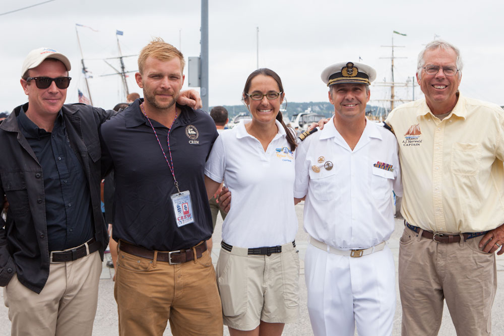 All five captains pose for a photo. From left: Sam Sikkema of the Picton Castle, Lynx Captain Jesse Doucette, Kalmar Nyckel Captain Lauren Morgens, Sagres Commanding Officer Paulo Portugal, and A.J. Meerwald Captain Jesse Briggs. (Credit: Katharine Schroeder)