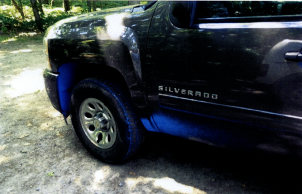 A photo filed to Southold Town shows the paint damage caused by a blue paint spill in Cutchogue last month. This damage — which also affected the back rims — cost the owner $ (Credit: William Smith)