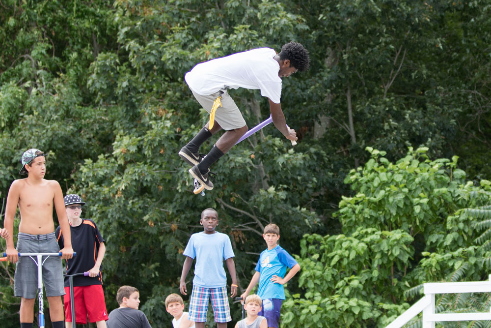 Darius Brew, 16, of Mattituck does a stunt while admirers look on.