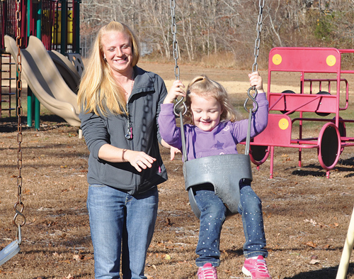 CARRIE MILLER PHOTO | Amber Abolafia of Orient plays with her daughter Dakota, 2, at Old Schoolhouse Park in East Marion, where she believes she was bit by a tick.