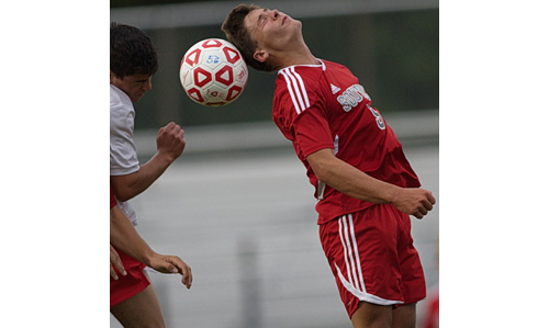 Sean Moran, heading the ball, scored Southold's lone goal against Center Moriches on a penalty kick. (Credit: Garret Meade)
