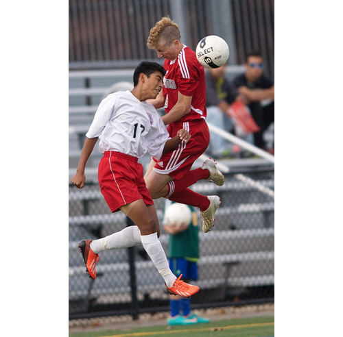 GARRET MEADE PHOTO | Pierson/Bridgehampton's Jon Lopez, left, and Southold's Shayne Johnson go airborne for a 50-50 ball.