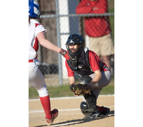 GARRET MEADE PHOTO | Southold/Greenport catcher Wendy Peterson caught a throw from third baseman Alexandra Small for a forceout at home plate of Center Moriches' Cheyenne Raimondi.